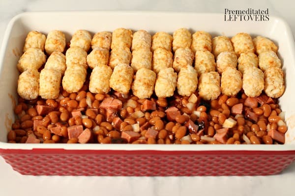 Layer tater tots over the beanie weenies.