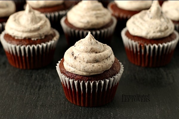 Homemade cookies and cream frosting on chocolate cupcakes.