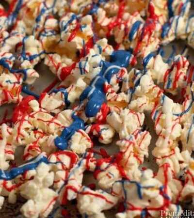red, white, and blue candy melts drizzled over popcorn
