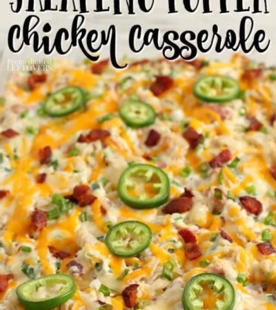 jalapeno popper chicken casserole topped with sliced jalapeno peppers