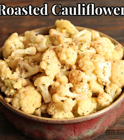 roasted cauliflower with spices in a red bowl
