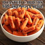 A bowl of roasted carrots with rosemary and garlic