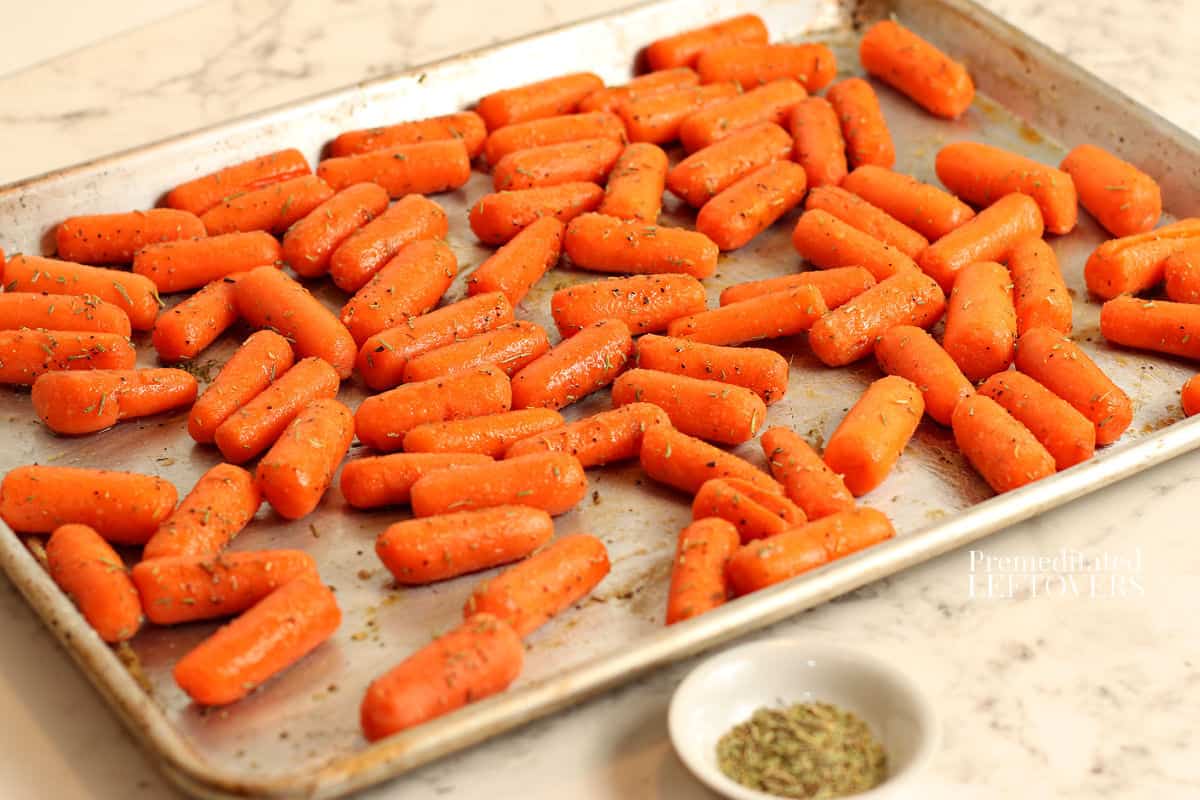 baby carrots on a sheet pan