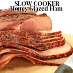 crock pot honey glazed ham on cutting board