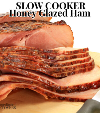 crock pot honey glazed ham on cutting board