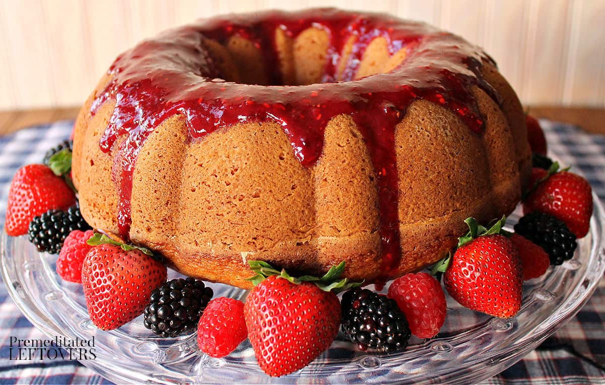 vanilla bundt cake recipe topped with a mixed berry glaze