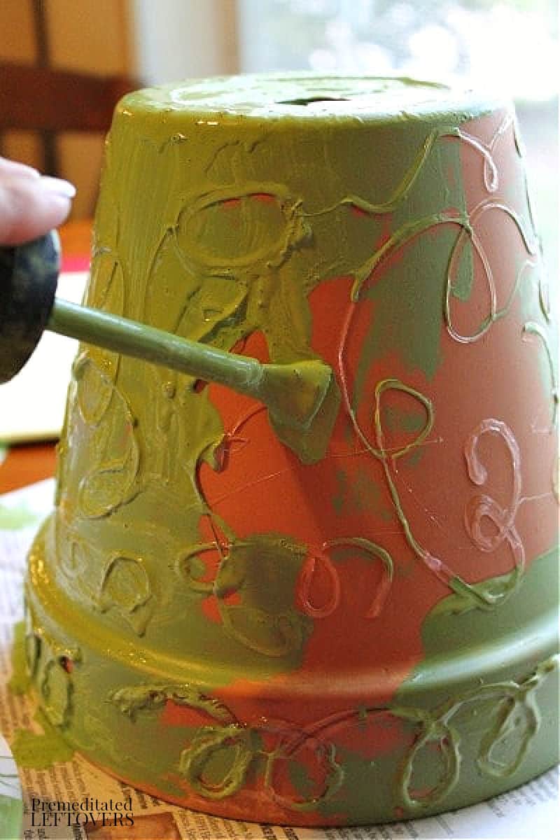 painting an embossed terra cotta pot