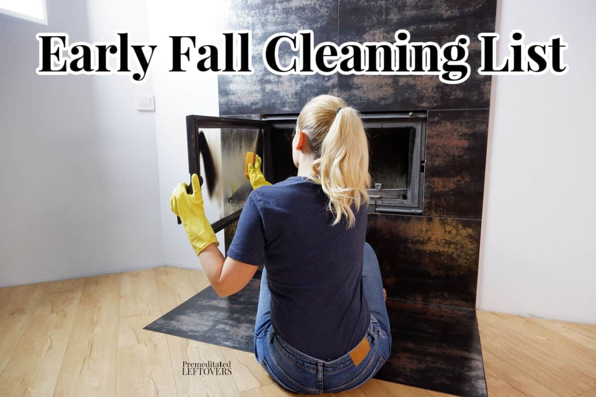 Woman cleans fireplace in fall to prep for winter.