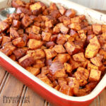 pumpkin pie spiced sweet potatoes in a casserole dish