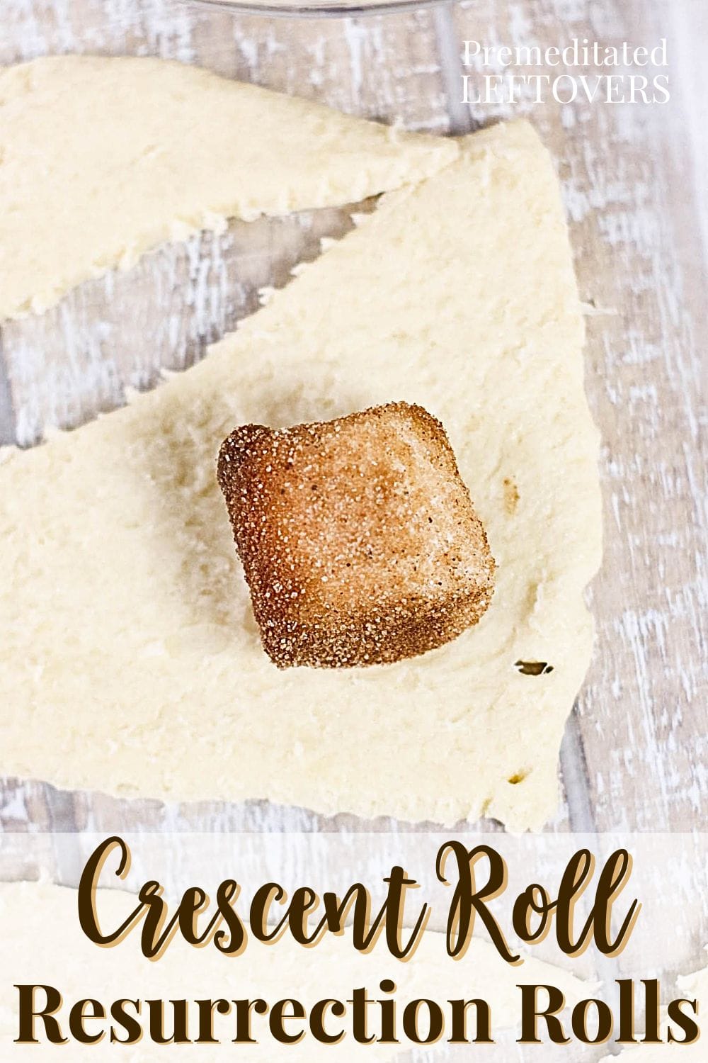 Place the coated marshmallow on the large end of the crescent roll triangle.