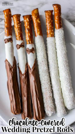 chocolate covered wedding pretzel rods that look like a bride and groom