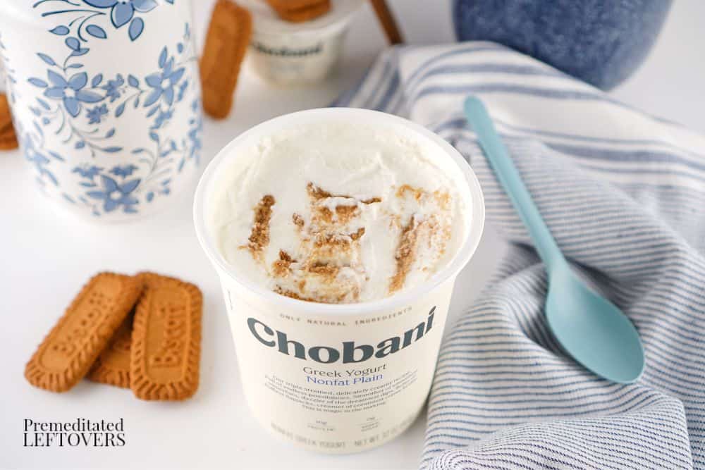 Biscoff cookies in a large tub of Greek Yogurt