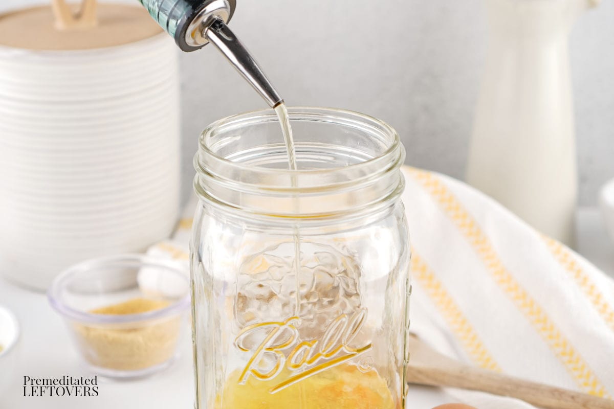 Gently pour the oil into the jar for Homemade Mayo Recipe
