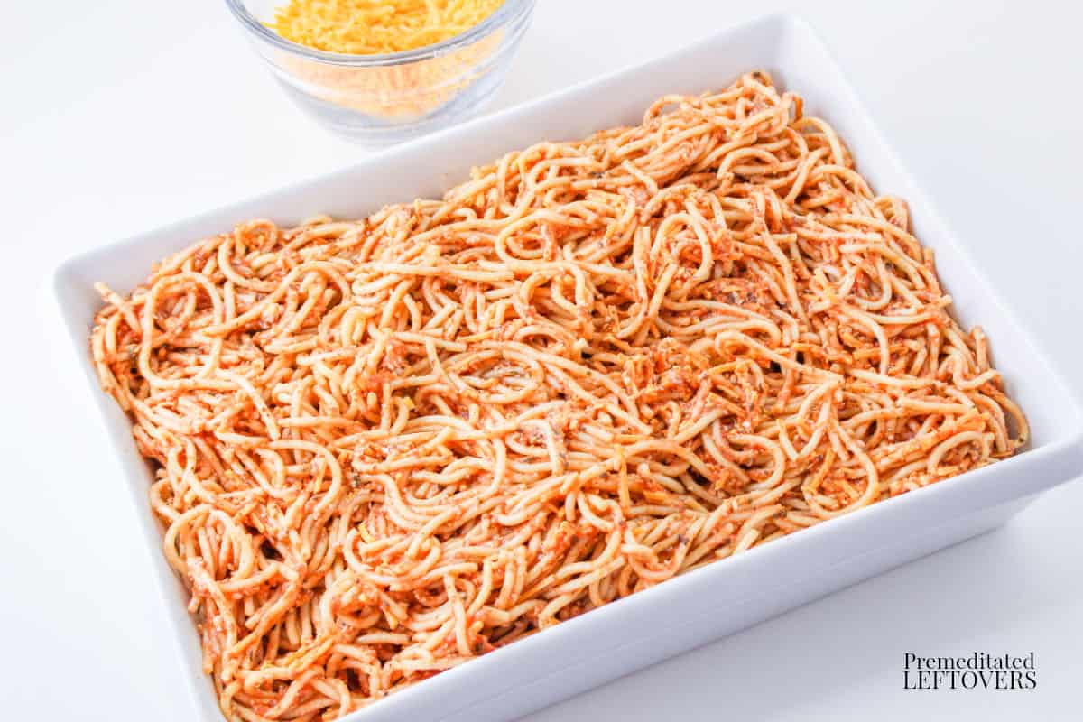 Place spaghetti mixture into baking dish for Leftover Spaghetti Bake Casserole