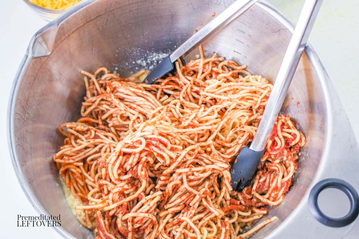 Mix in noodles, sauce, and half the cheese for Leftover Spaghetti Casserole